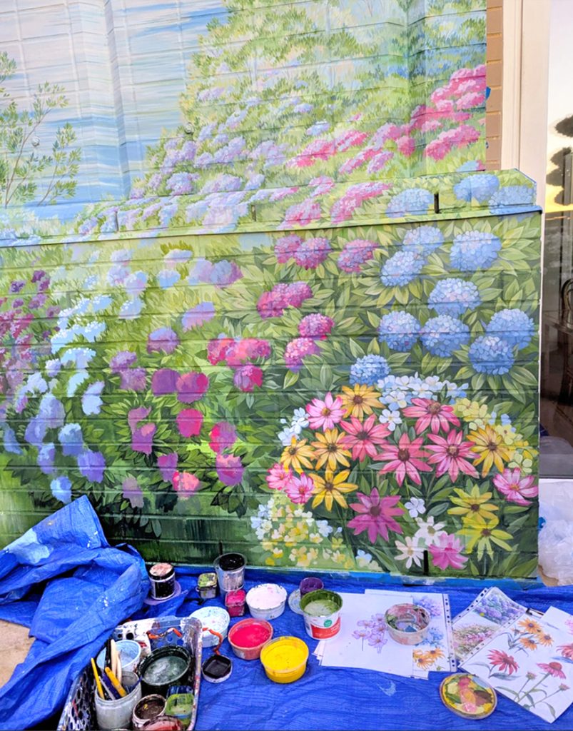 rooftop-balcony-mural-process-washington-dc Artist painting rooftop balcony mural at private residence in Washington DC with paints.