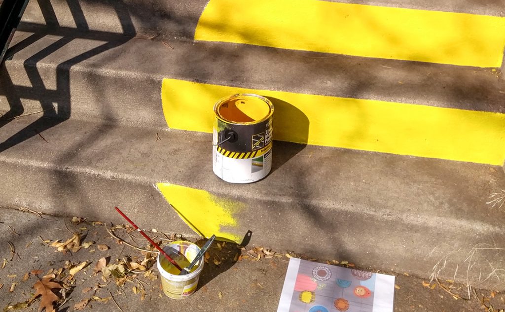 Professional mural paint being used at a staircase mural painting by public art mural artist Yulia Avgustinovich