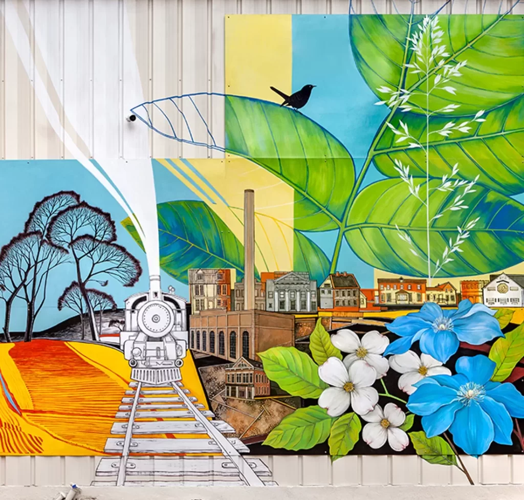 public-art-mural-the-tales-of-our-town-batesville-indiana with train, dog wood tree flower, farm fields and railroad.