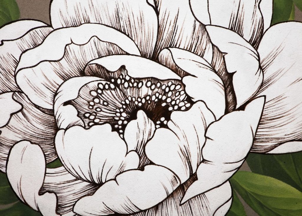 Close-up detail of a floral mural featuring realistic flowers blended with black-and-white etched botanical textures.