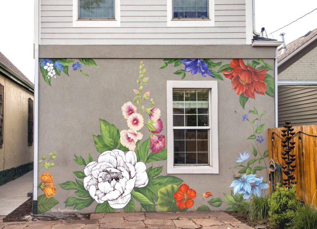 Floral mural on the exterior of a private residence in Denver’s RiNo district, combining realistic flowers with black-and-white etched elements.
