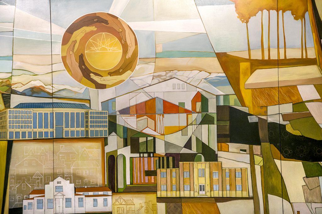 auroras-beauty-mural-detail-landmarks-flora-fauna Close-up detail of an interior mural showing Aurora landmarks, plants, and wildlife painted in a cohesive panoramic composition.