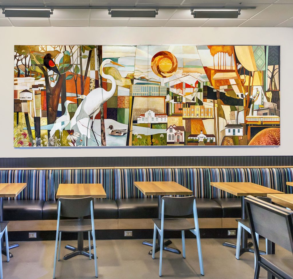 Interior mural titled “Aurora’s Beauty” in a Kroger supermarket in Aurora, Colorado, featuring city landmarks, parks, and local flora and fauna.