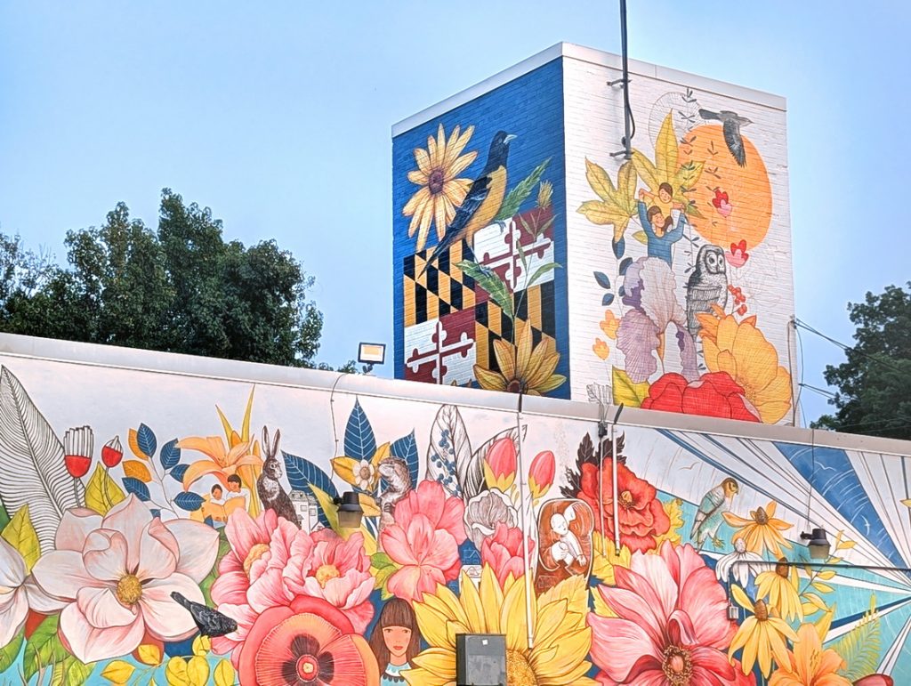 Symbolic public art mural on the Town Hall tower in Landover Hills, Maryland, featuring state symbols: state flower, sate bird of Maryland and Maryland Flag.