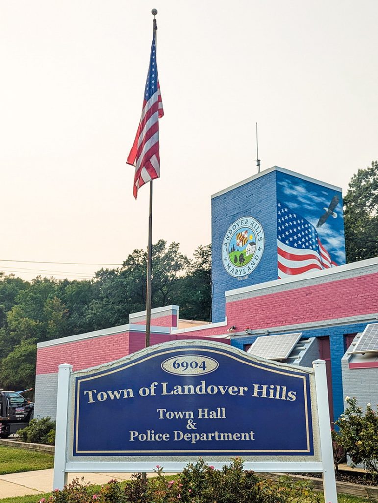 Symbolic public art mural on the Town Hall building in Landover Hills, Maryland, featuring state symbols, the American flag with bald eagle, and the town seal