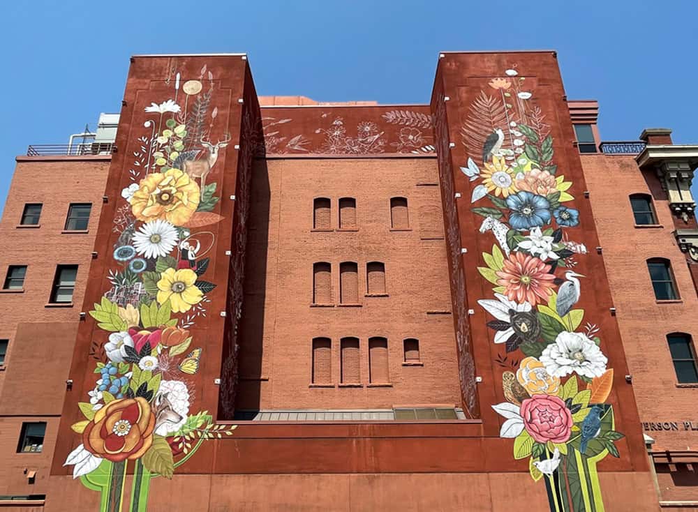 Symbolic public mural in downtown Boise, Idaho featuring state symbols and cultural history