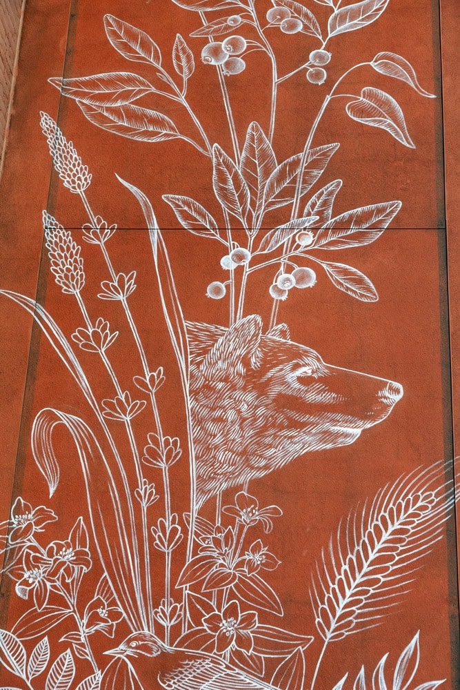 Symbolic public mural enhancing the streetscape of downtown Boise, Idaho with white outline and bear