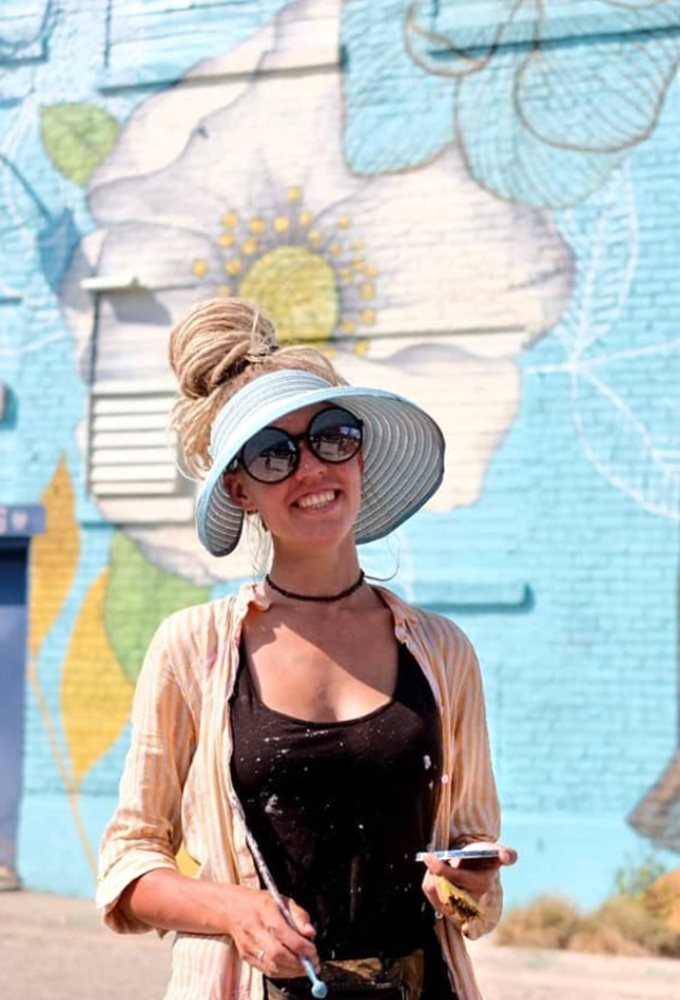 Portrait of mural artist and educator Yulia Avgustinovich.